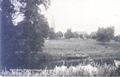 St Marys Church Woodford and girl in rowing boat